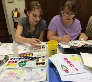 Claire Jenness and Robin Edmundson practice tulips at the June meeting.